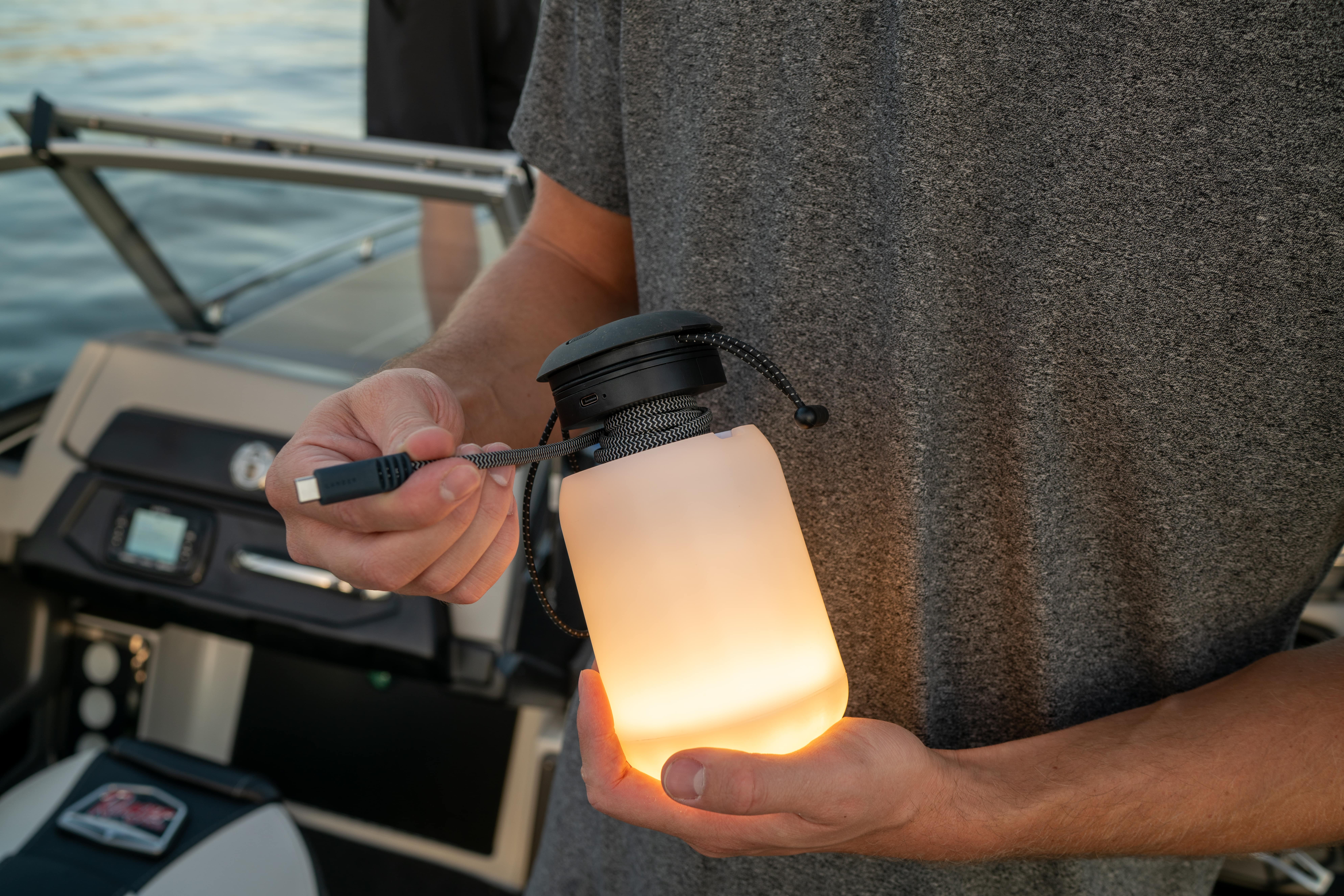  Boulder lantern with charging cord on a fishing boat